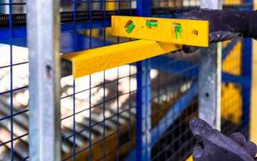 Anti-slip U-profile ladder rung covers fitted on round rungs to improve ladder safety at Smurfit Westrock.